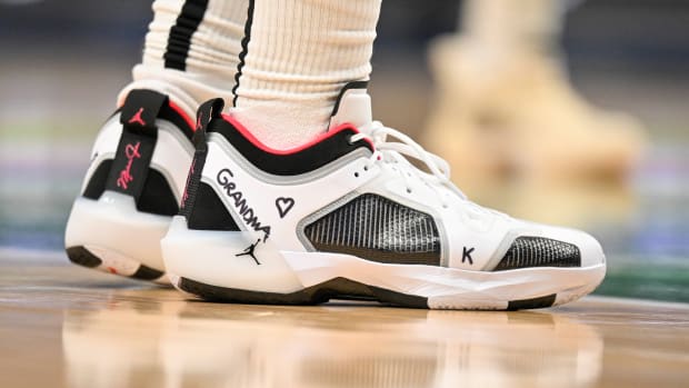 View of Bradley Beal's white, black, and red Air Jordan shoes.
